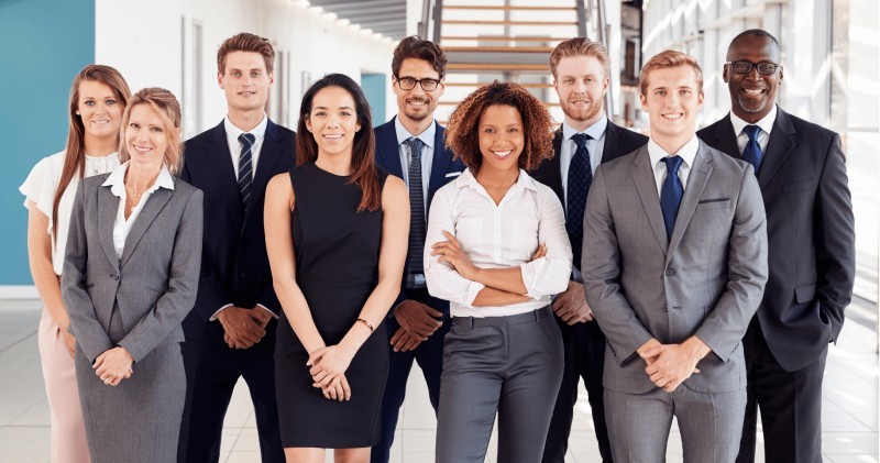 Permanent recruitment team posing professionally