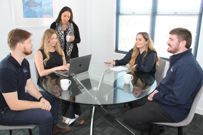 Recruitment team collaborating in a modern office