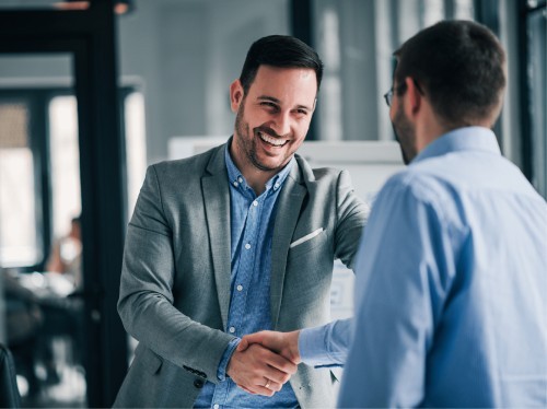 Recruitment specialist shaking hands with a business owner